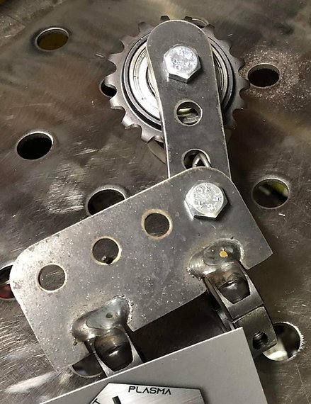 61549d_c4e6caba2fb6470ab8d2e83cada8b202mv2.jpg Spring Loaded Chain Tensioner